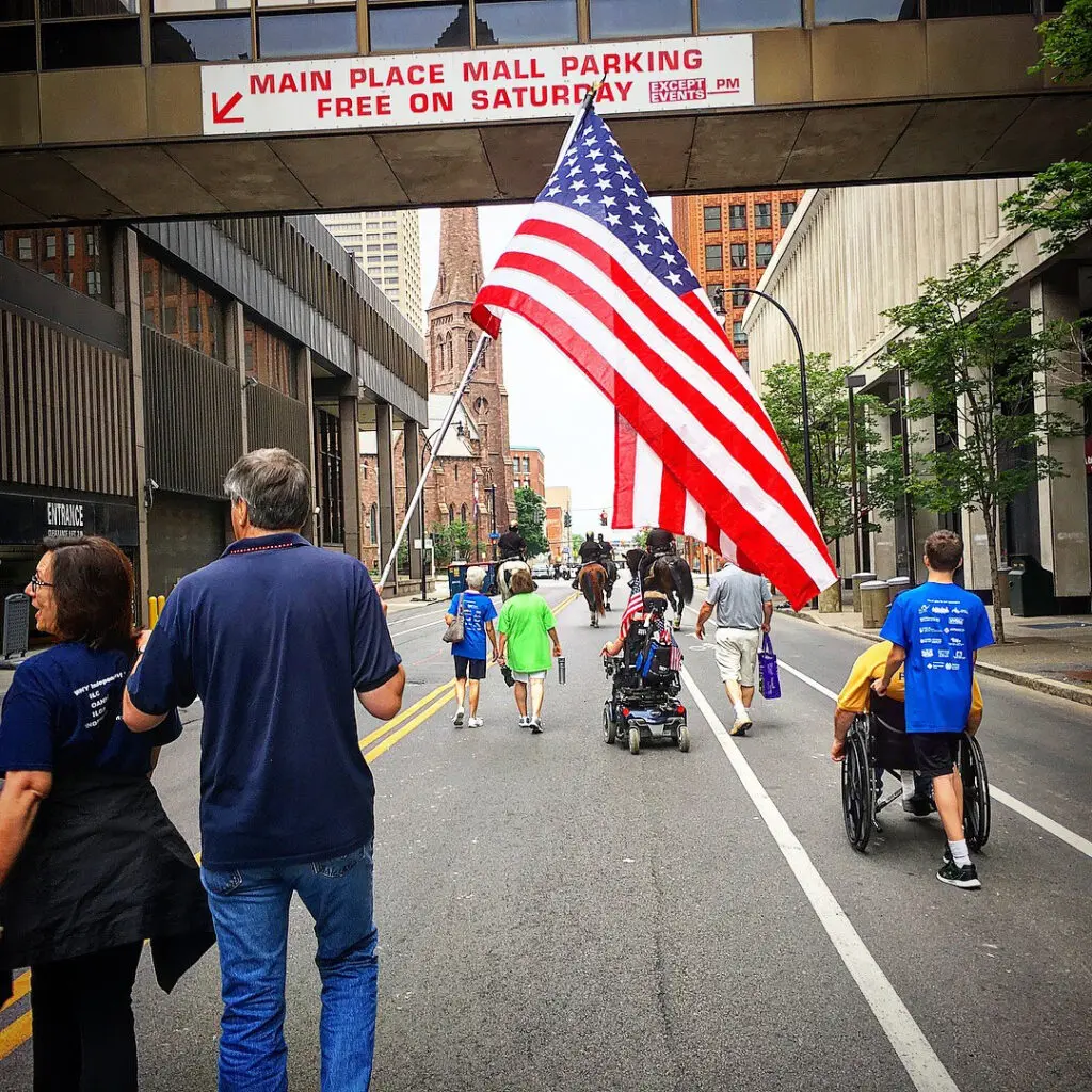 Parade walkers and attendees in wheelchairs for WNYIL