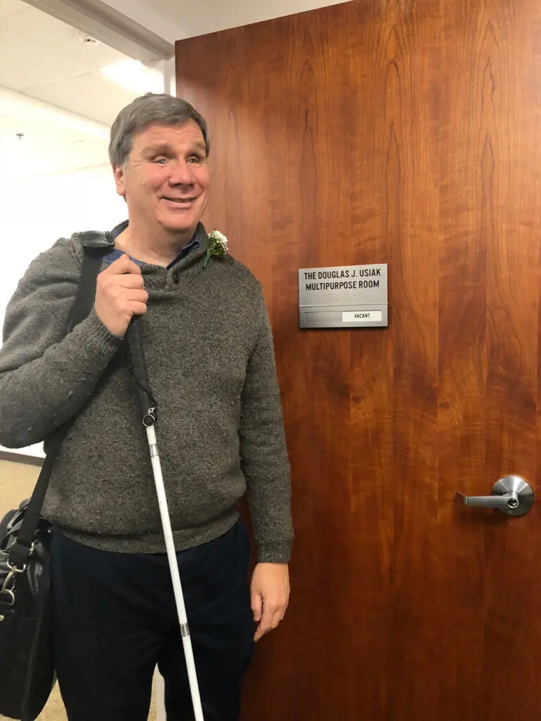 Blind male guest attending ILGR open house