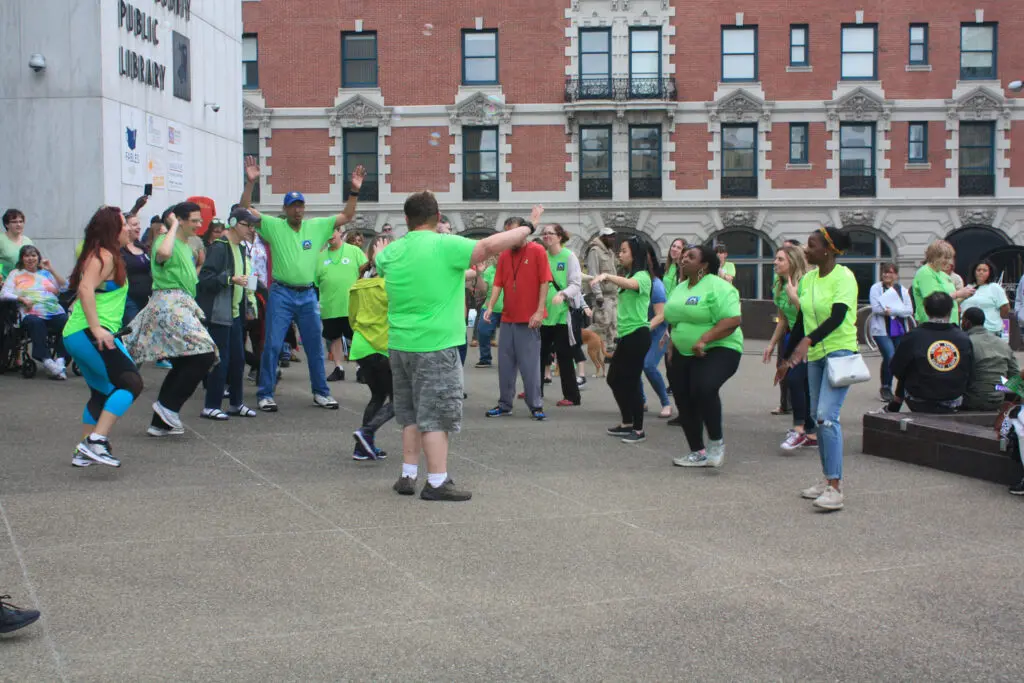 MHPC flash mob group dancing outside of the library
